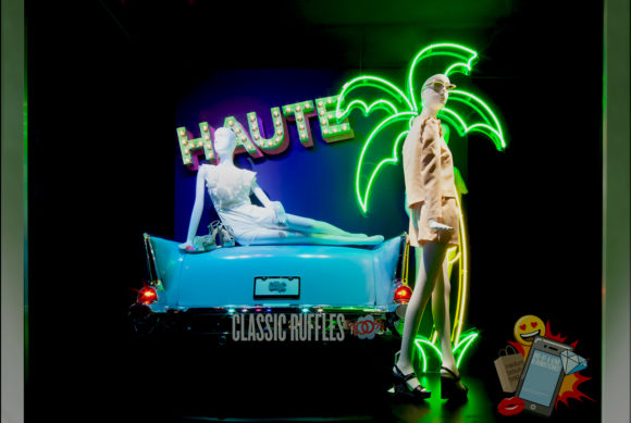 Bloomingdales Window Display with neon palm tree and blue car haute for Classic Ruffles